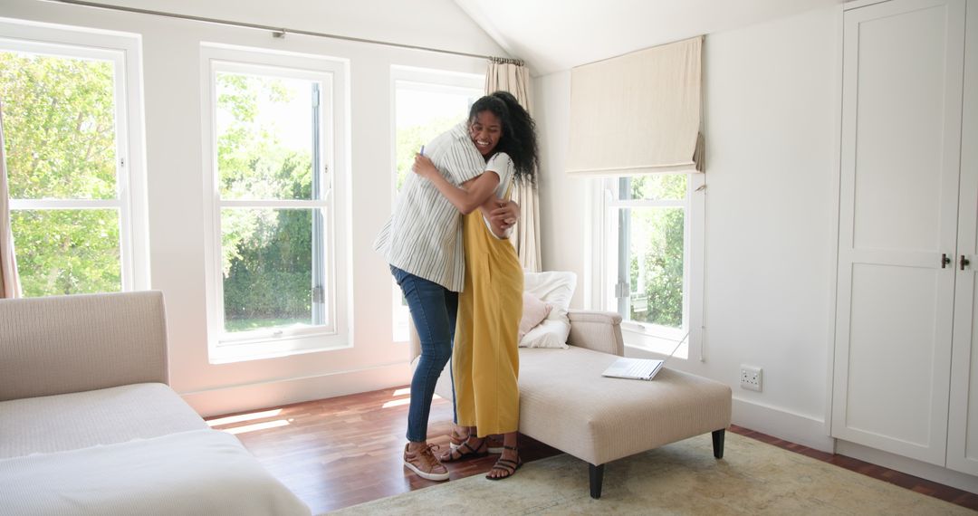 Couple Embracing in Bright Living Room with Open Windows
