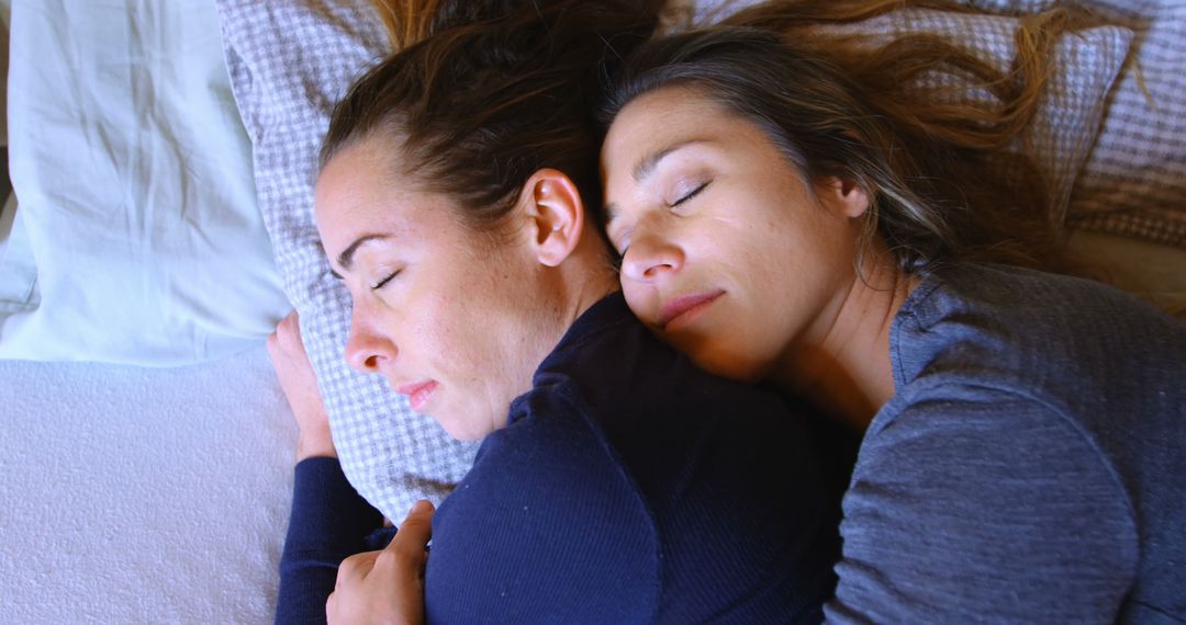 Two Women Sleeping Peacefully Hugging in Comfortable Bed - Free Images, Stock Photos and Pictures on Pikwizard.com