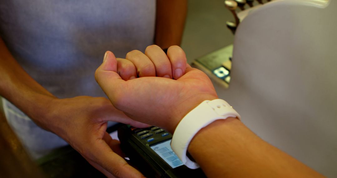 Contactless Payment with Smartwatch at Checkout Counter - Free Images, Stock Photos and Pictures on Pikwizard.com