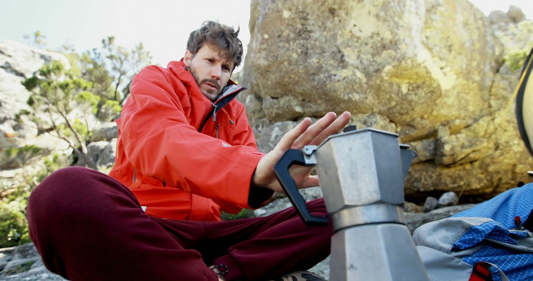 Man Camping Preparing Coffee on Portable Stove in Wilderness - Free Images, Stock Photos and Pictures on Pikwizard.com