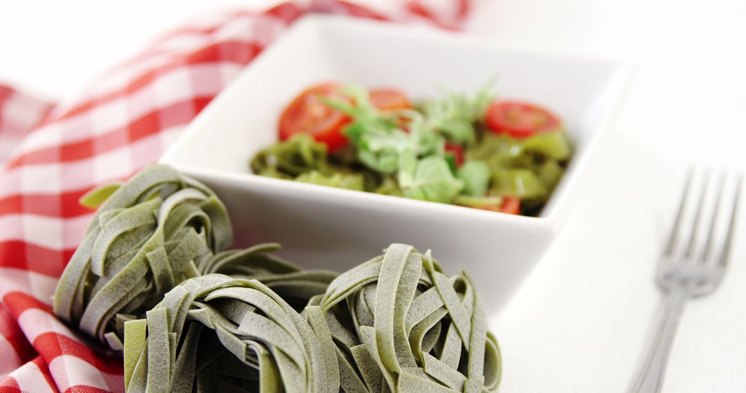 Fresh Spinach Tagliatelle with Cherry Tomatoes and Arugula Salad - Free Images, Stock Photos and Pictures on Pikwizard.com