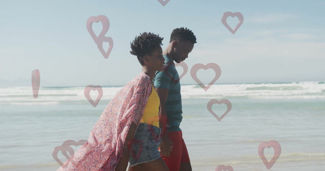 Romantic Couple Strolling Beachside with Floating Hearts