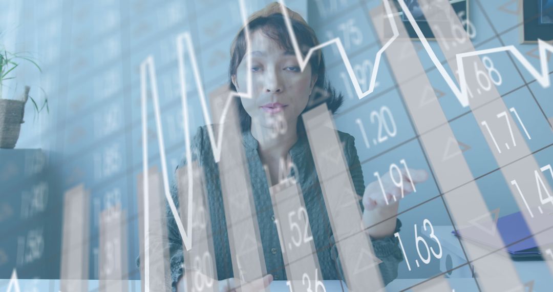 Businesswoman Analyzing Financial Data at Office Interface