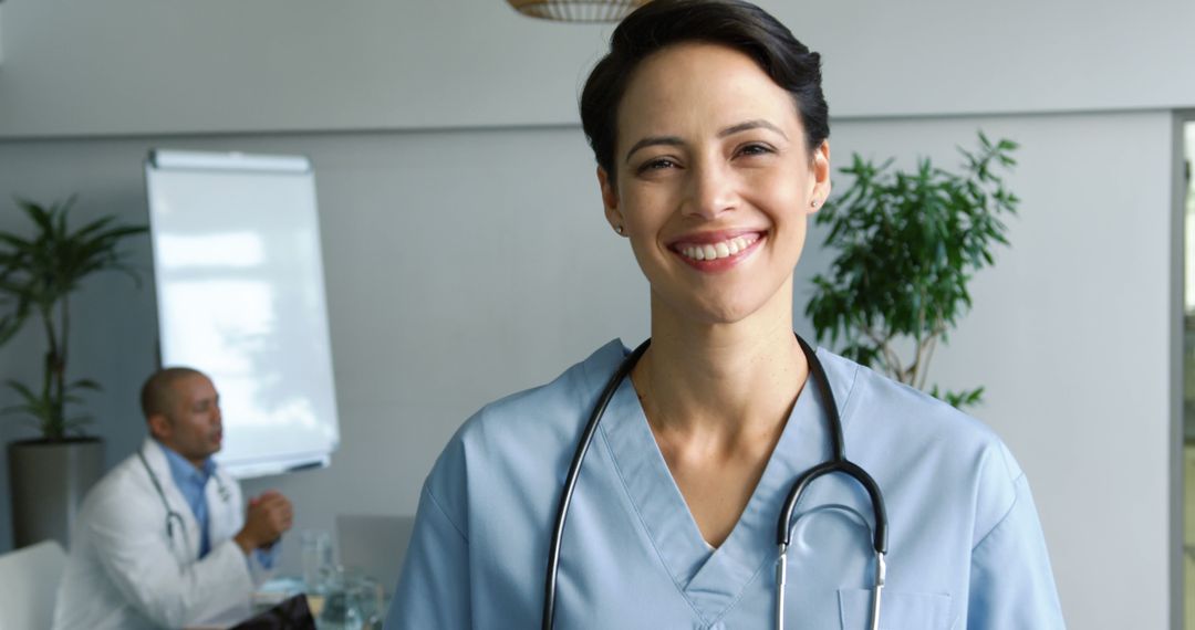 Smiling Female Doctor with Stethoscope in Hospital Office - Free Images, Stock Photos and Pictures on Pikwizard.com