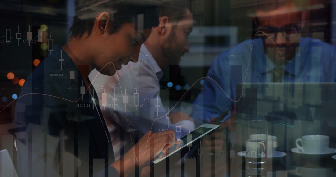 Diverse Business Team Analyzing Financial Data at Night