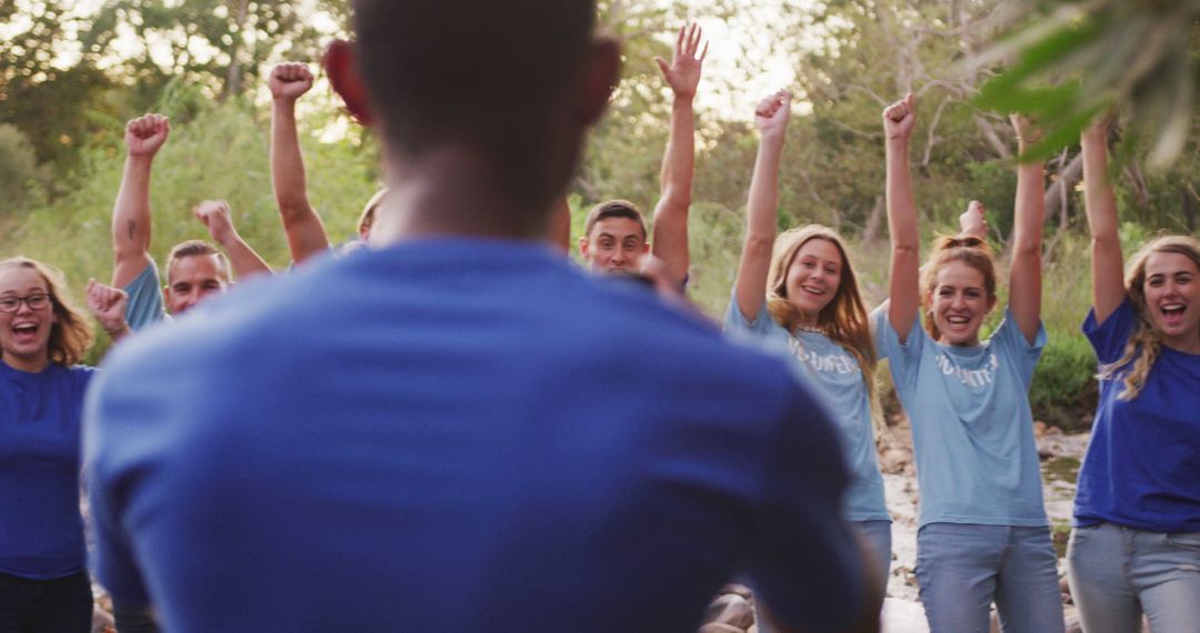 Diverse Group Celebrating Outdoors in Blue Shirts - Free Images, Stock Photos and Pictures on Pikwizard.com