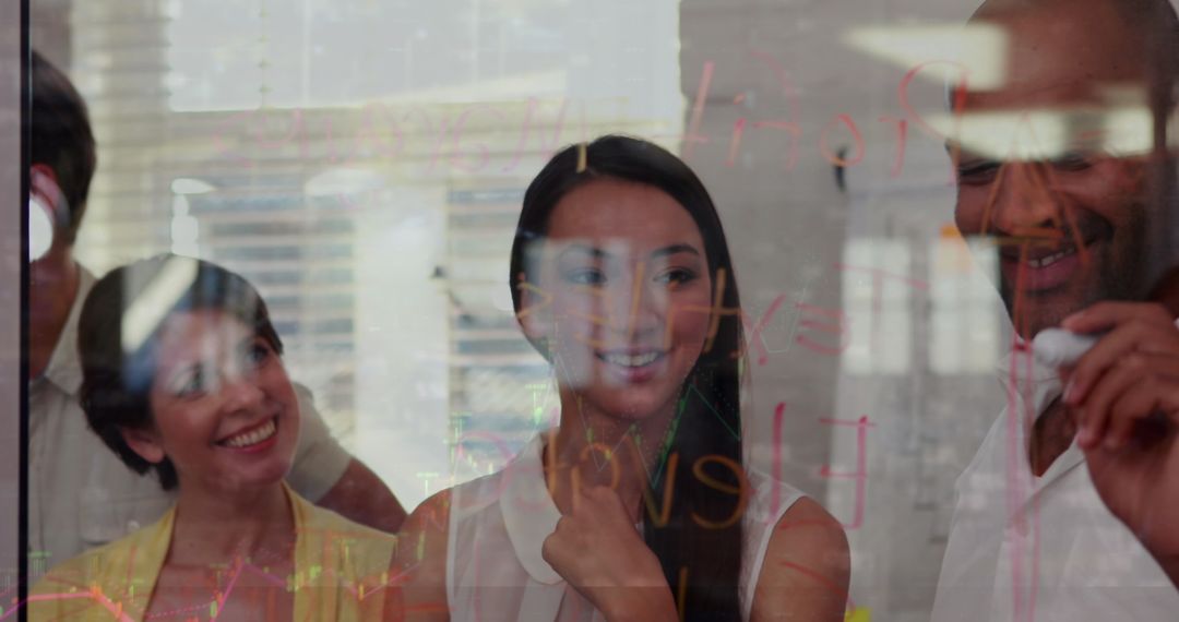 Diverse Team Analyzing Data Trends in Modern Office Environment