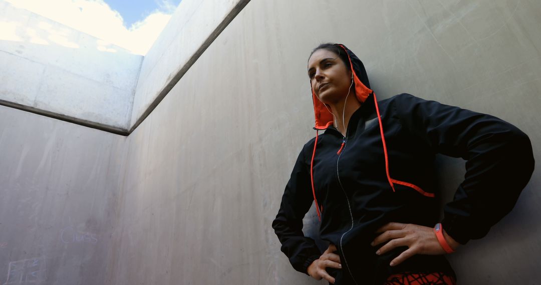 Determined Woman Standing in Concrete Urban Structure - Free Images, Stock Photos and Pictures on Pikwizard.com