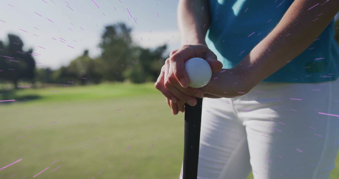 Golfer Placing Ball on Fairway with Focused Grip