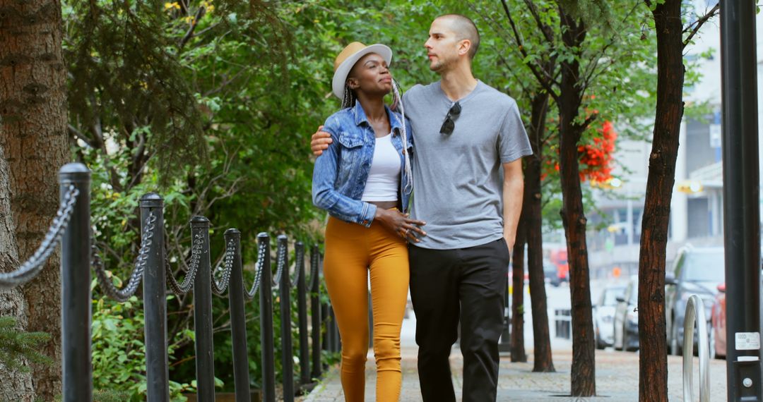 A young interracial couple enjoys a pleasant walk in the city. - Free Images, Stock Photos and Pictures on Pikwizard.com