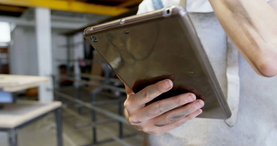 Manual Worker Using Tablet in Workshop - Free Images, Stock Photos and Pictures on Pikwizard.com