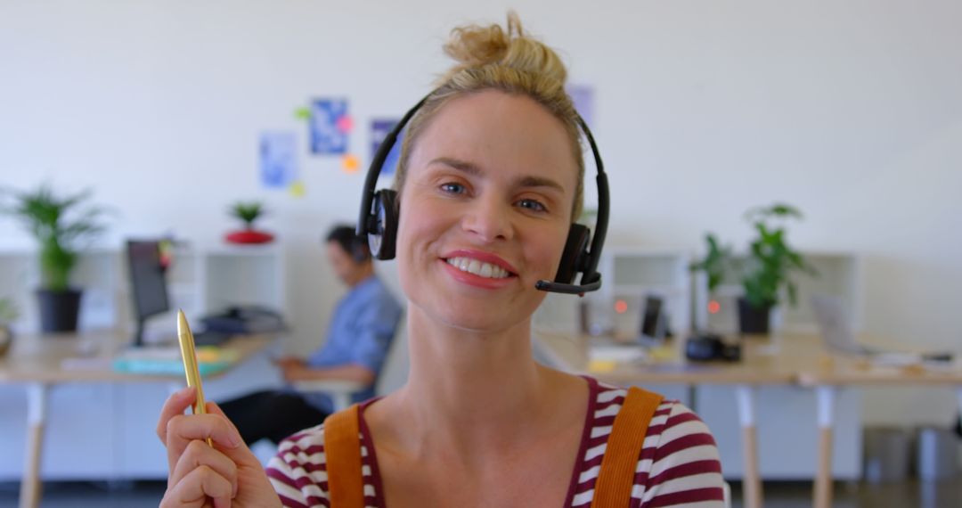Smiling Businesswoman with Headset in Modern Office Environment