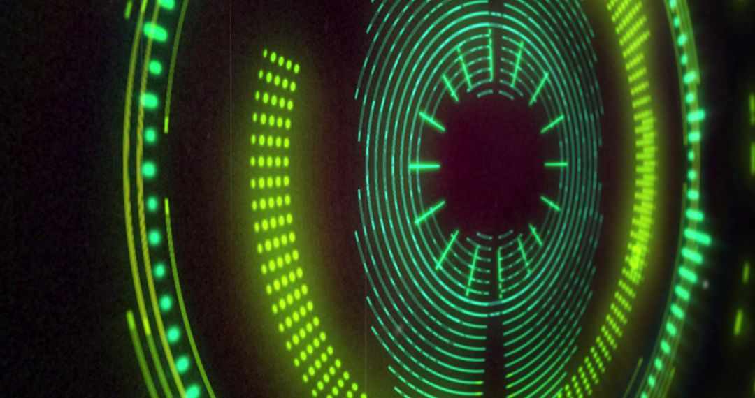 Futuristic Circular Green and Pink Light Display with Rotating Patterns