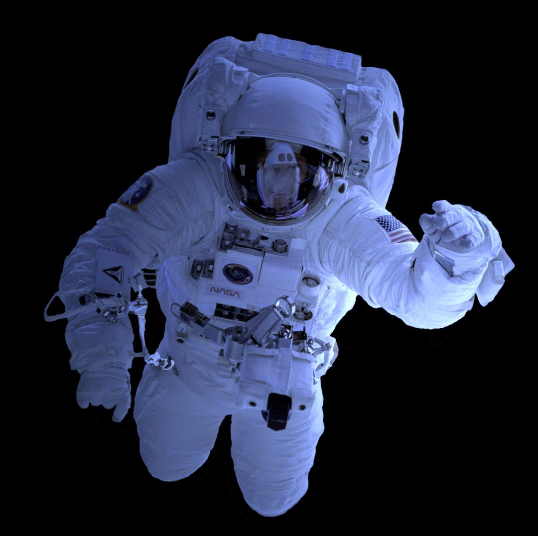 Astronaut in Space Suit Floating in Darkness of Space - Free Images, Stock Photos and Pictures on Pikwizard.com