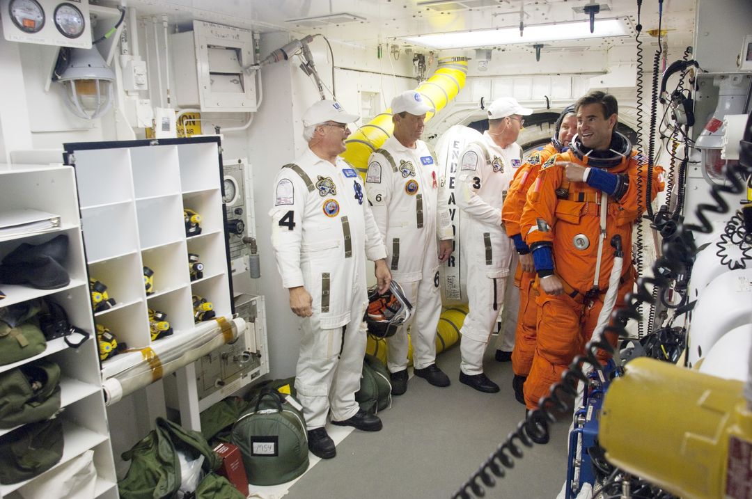 Crew Assisting Astronauts Before Boarding Space Shuttle Endeavour for STS-134 Mission