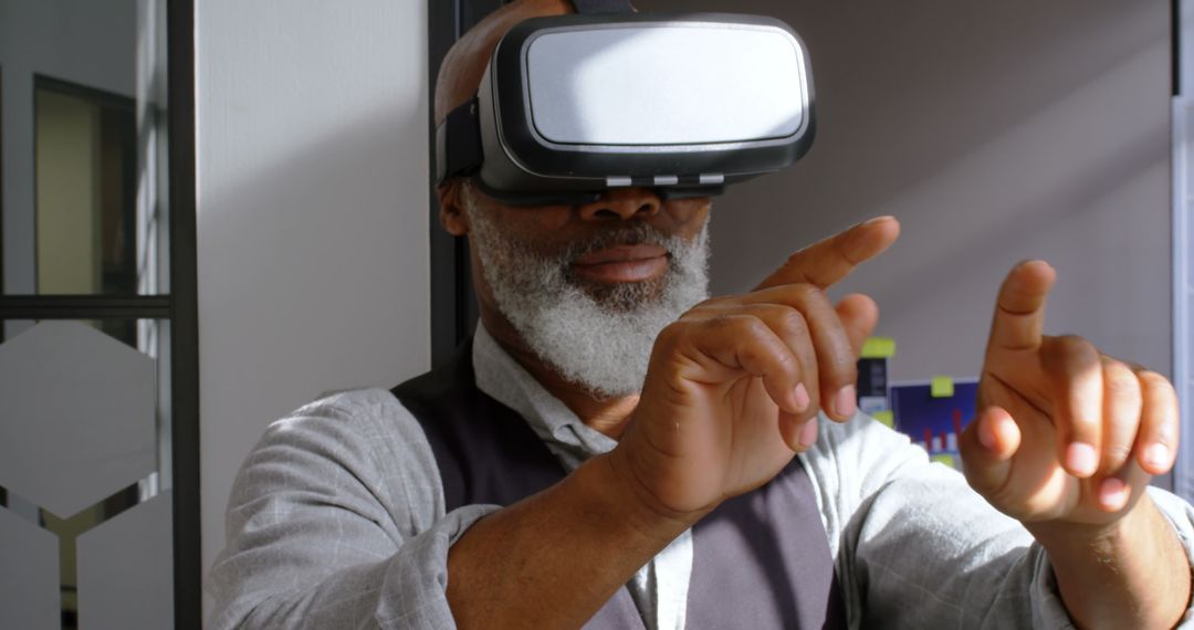 Older Man Using Virtual Reality Headset - Free Images, Stock Photos and Pictures on Pikwizard.com