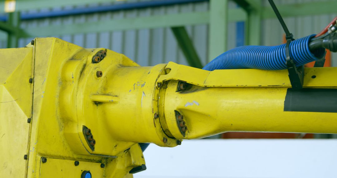 Close-up of Industrial Robotic Arm with Yellow Body - Free Images, Stock Photos and Pictures on Pikwizard.com