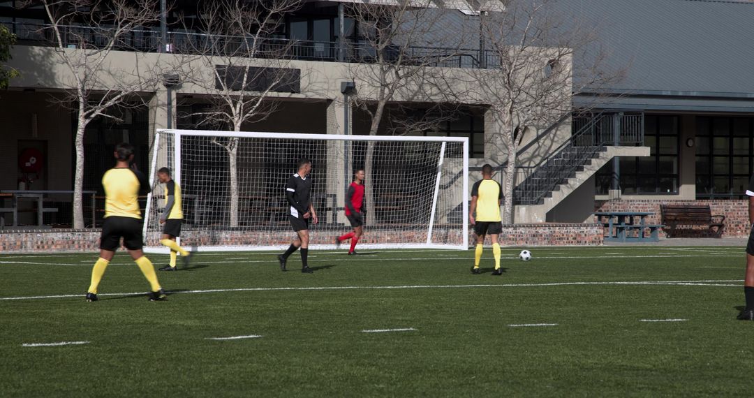 Soccer Players Strategizing During Intense Match
