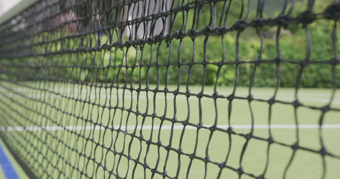 Closeup of Recreational Tennis Court Net on Green Background - Free Images, Stock Photos and Pictures on Pikwizard.com