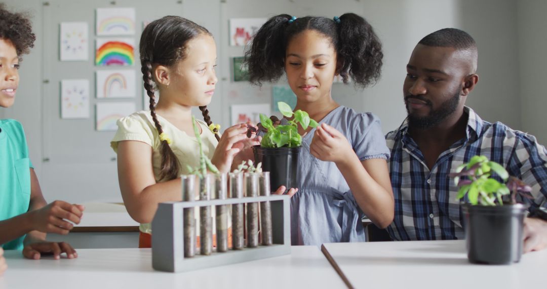 Image of happy african american male teacher and class of diverse pupils during biology lesson - Free Images, Stock Photos and Pictures on Pikwizard.com