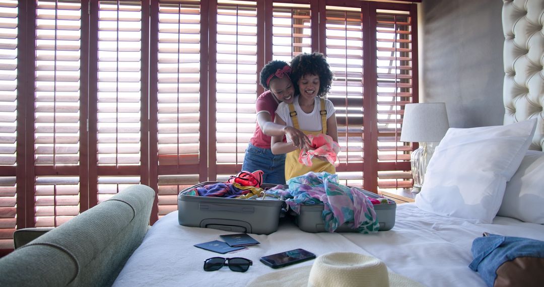 Joyful Couple Packing Suitcase for Summer Vacation