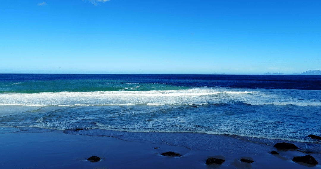 Serene Seascape with Waves under Clear Blue Sky