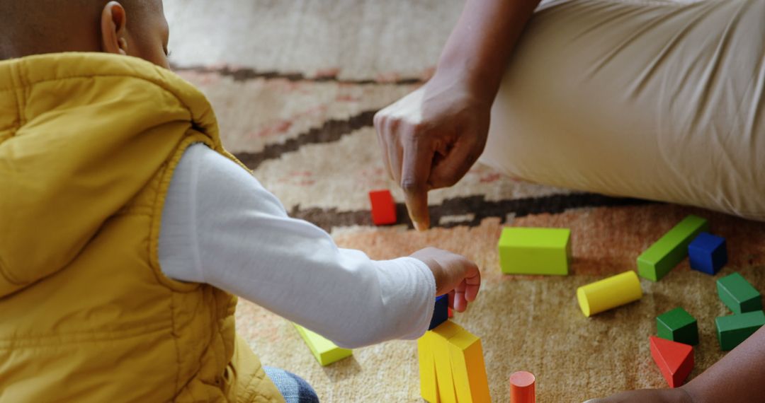 Father and Son Engaged in Creative Block Building at Home
