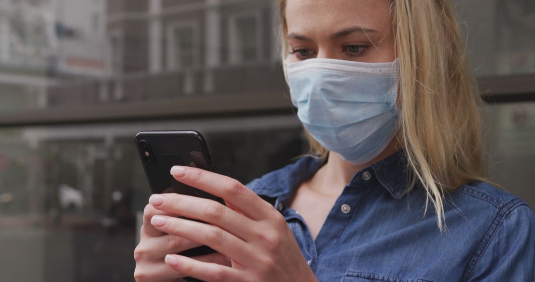 Woman Wearing Protective Mask Using Smartphone Outdoors - Free Images, Stock Photos and Pictures on Pikwizard.com