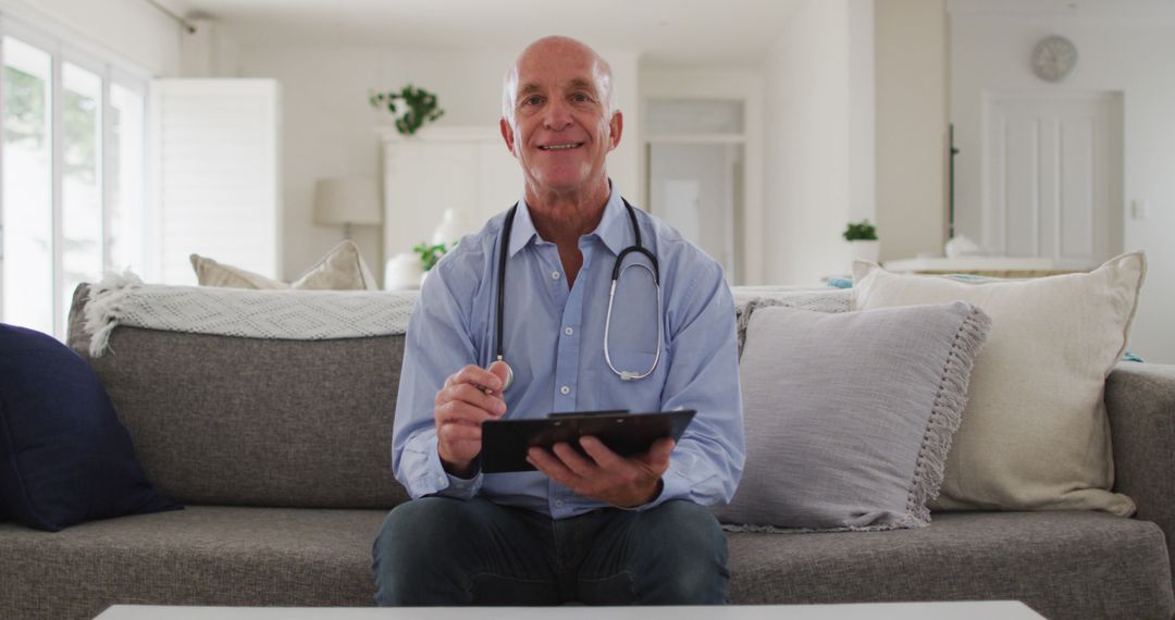 Senior Doctor Using Digital Tablet on Sofa - Free Images, Stock Photos and Pictures on Pikwizard.com