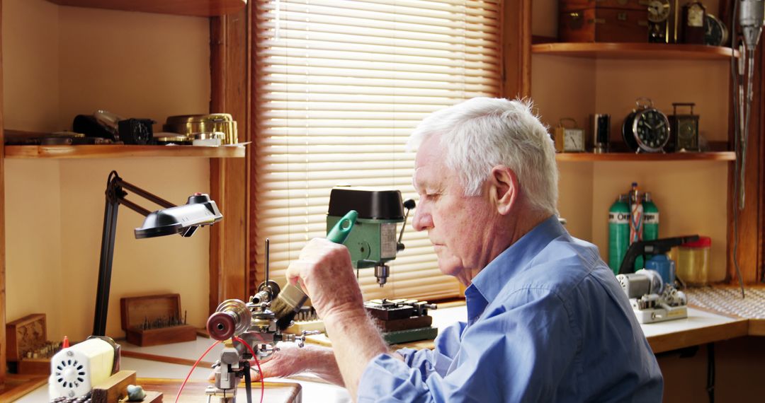 Elderly Man Crafting with Precision Tools in Workshop - Free Images, Stock Photos and Pictures on Pikwizard.com