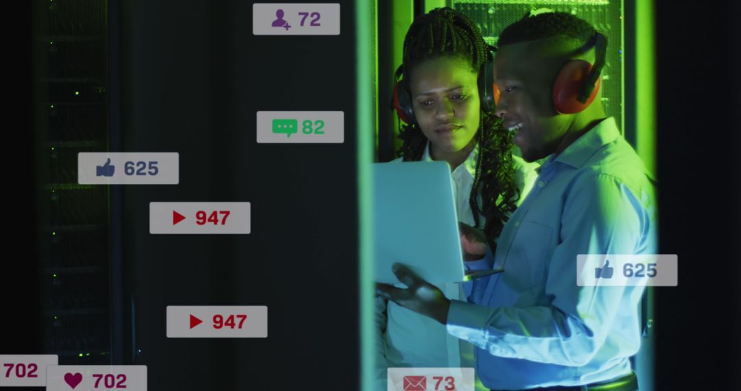 Diverse IT Technicians Monitoring Data with Social Media Overlays