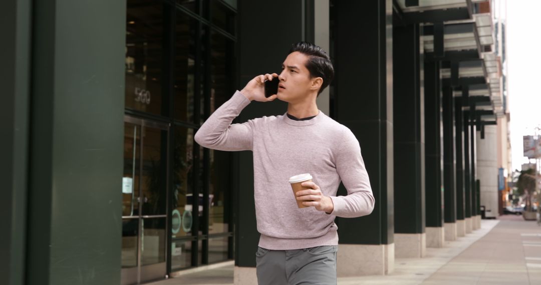 Businessman Talking on Phone and Drinking Coffee Outdoors - Free Images, Stock Photos and Pictures on Pikwizard.com