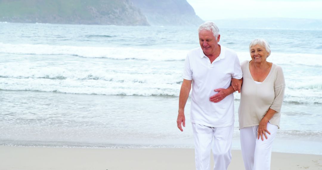 Senior Couple Enjoying Beach Walk with Scenic View