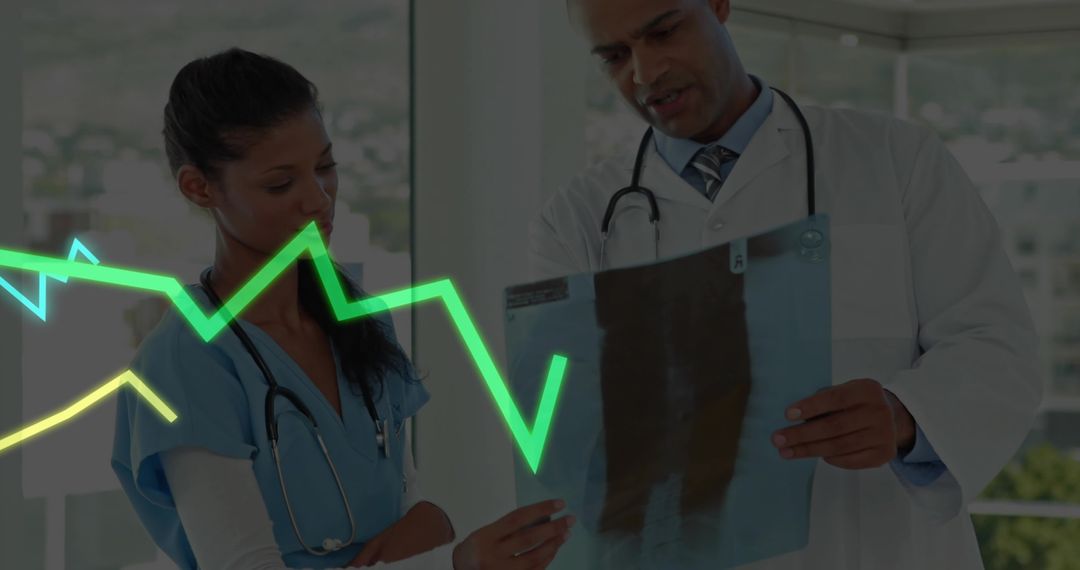 Medical Team Analyzing X-Ray with ECG Monitoring in Clinical Setting