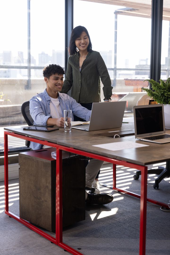 Diverse Coworkers Collaborating at Modern Office Table
