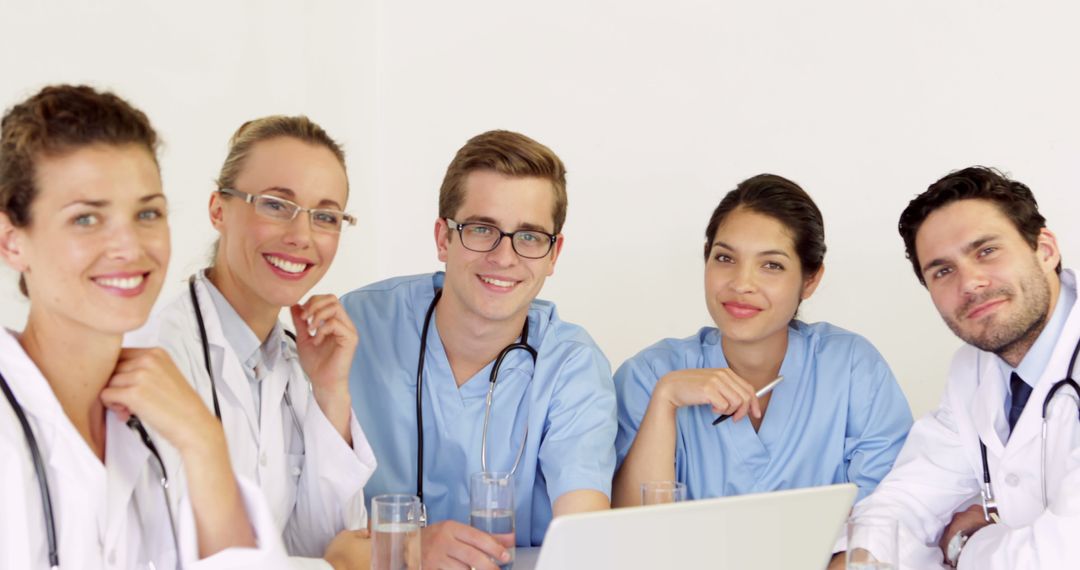 Medical Team Collaborating at Work Table - Free Images, Stock Photos and Pictures on Pikwizard.com