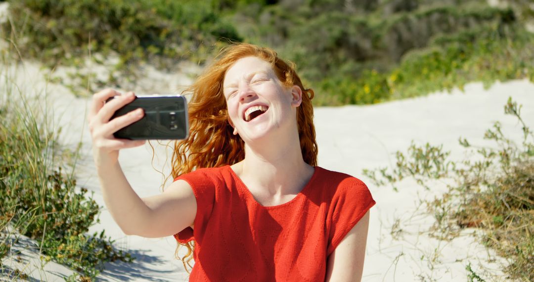 Woman Taking Selfie on Beach, Enjoying Sunny Day - Free Images, Stock Photos and Pictures on Pikwizard.com