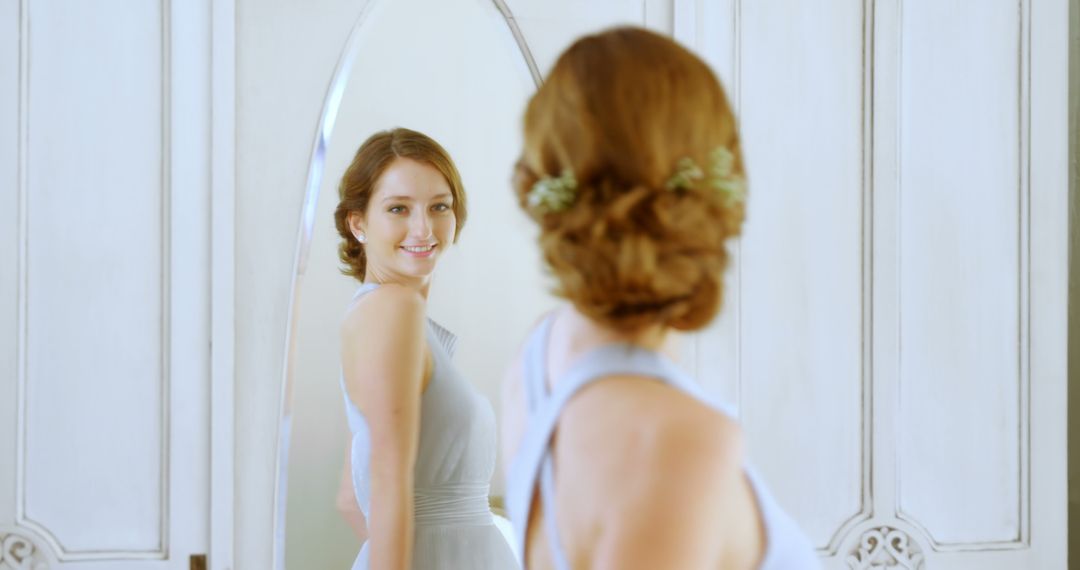 Bride getting ready looking at mirror smiling - Free Images, Stock Photos and Pictures on Pikwizard.com