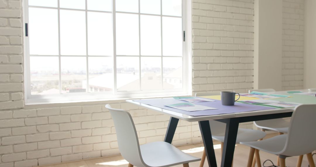 Modern Office Workspace with Large Window and White Furniture - Free Images, Stock Photos and Pictures on Pikwizard.com