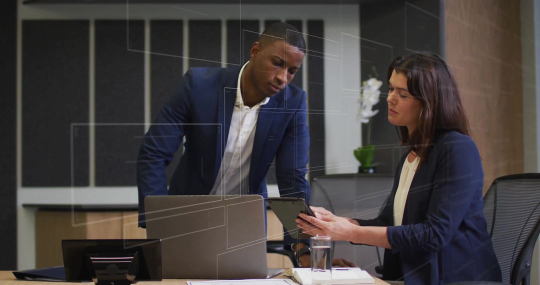 Diverse Business Team Reviewing Digital Data with Tablet