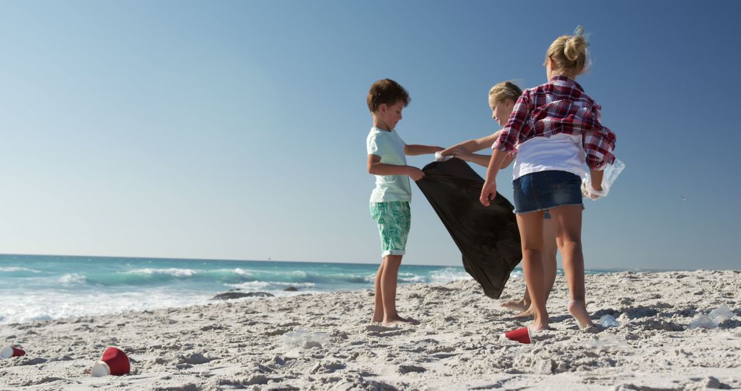 Children Cleaning Beach Environment on Summer Day - Free Images, Stock Photos and Pictures on Pikwizard.com