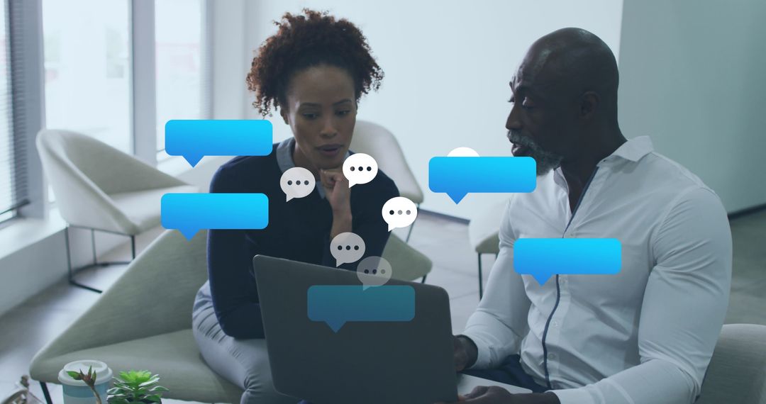 Diverse Business Team Collaborating Over Digital Interface Concepts