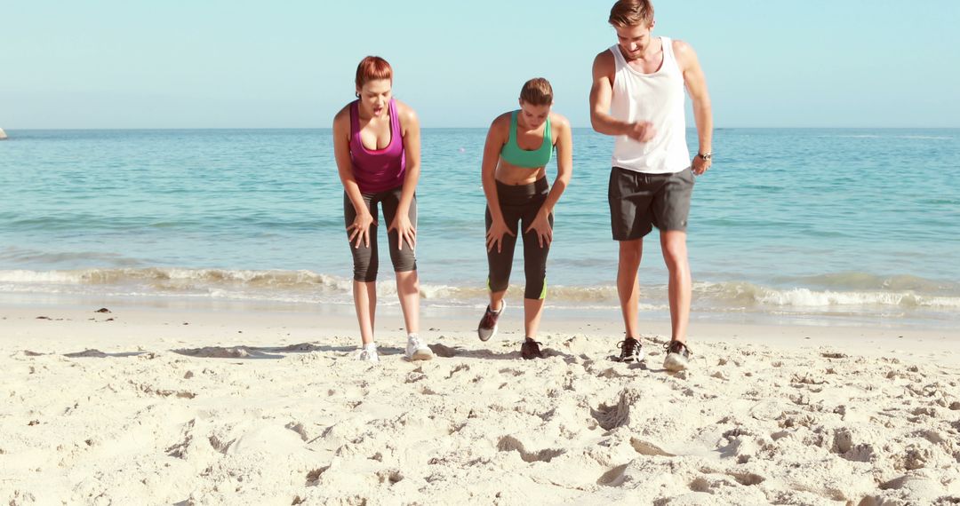 Group of Friends Running on Beach Taking a Break - Free Images, Stock Photos and Pictures on Pikwizard.com