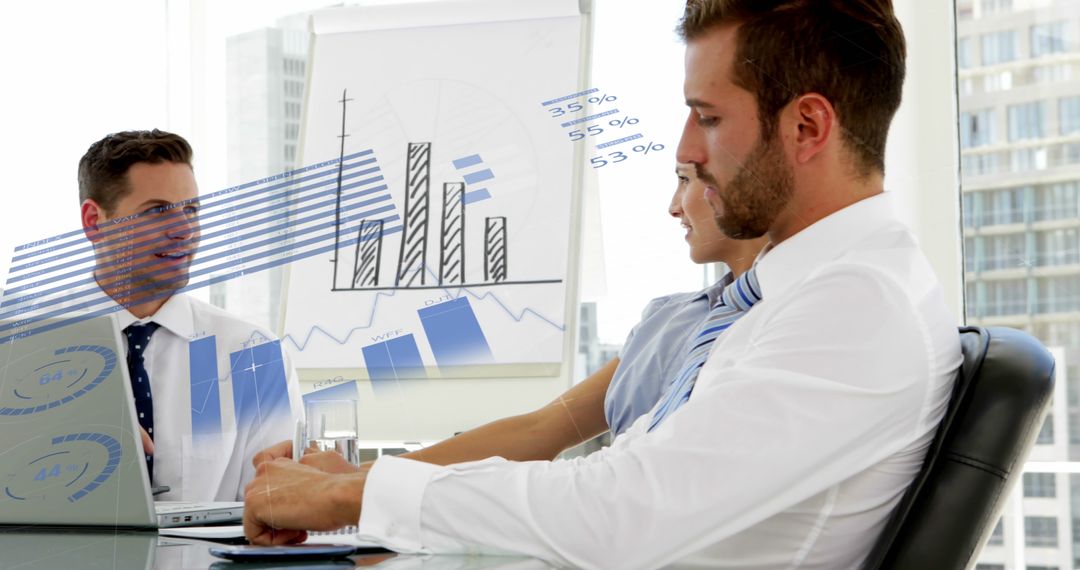 Business Professionals Analyzing Statistical Data at Meeting