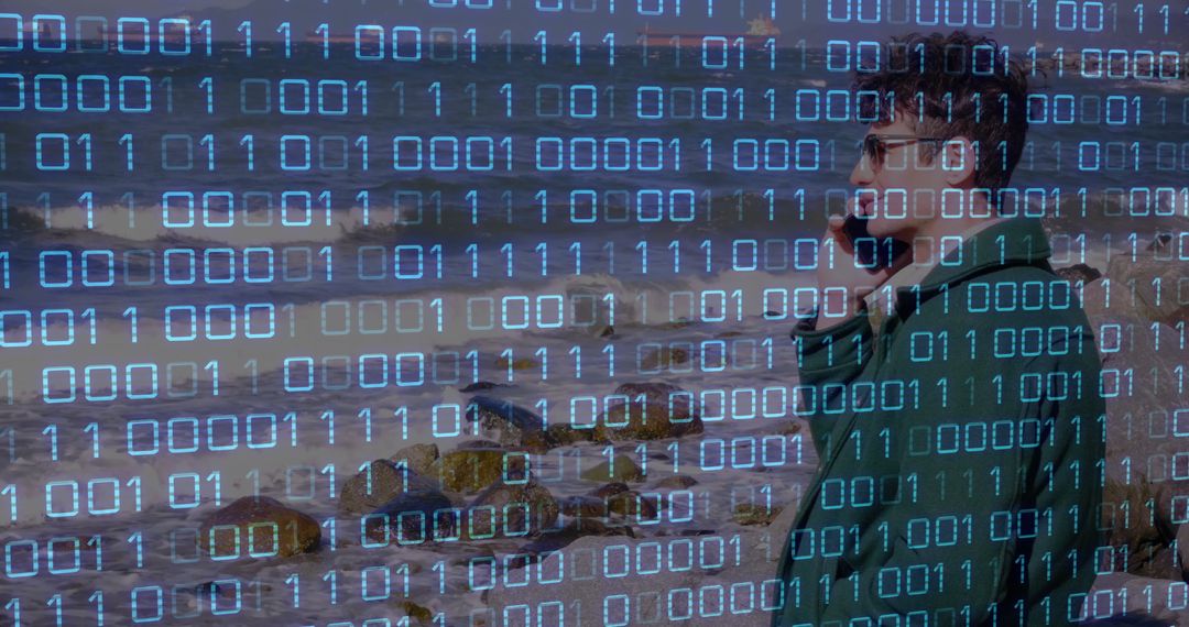 Man with Smartphone on Coast Overlayed by Binary Code