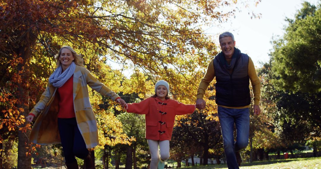 Happy Family Enjoying Autumn Day in Park - Free Images, Stock Photos and Pictures on Pikwizard.com