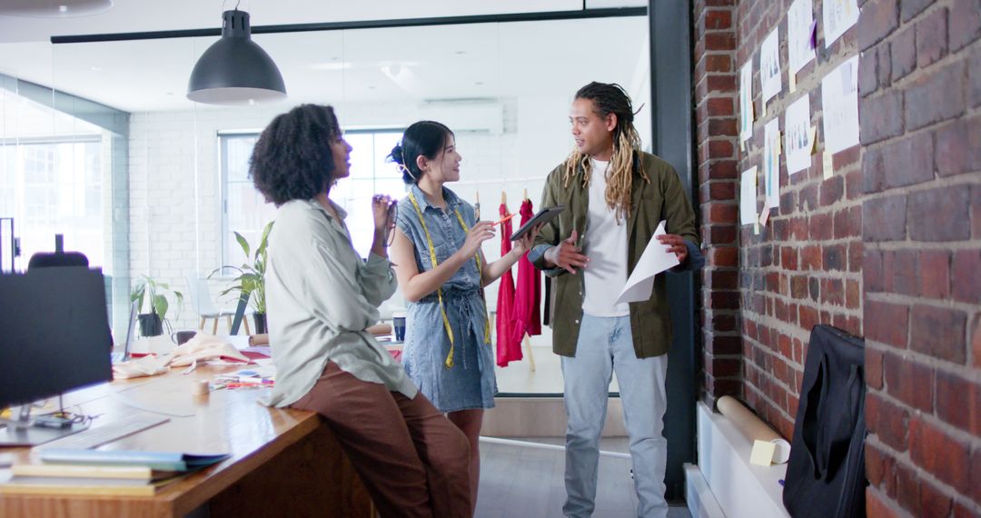 Diverse Creative Team Collaborating in Fashion Design Office