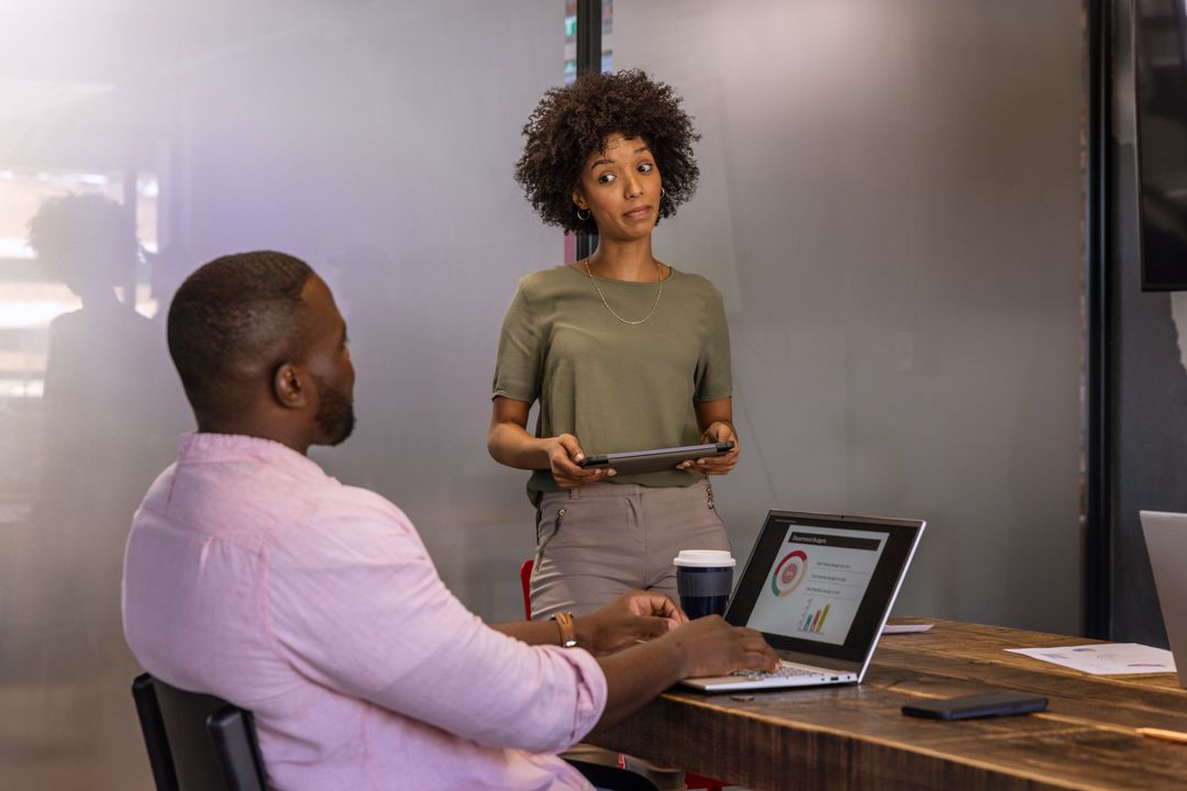 Coworkers Meeting in Modern Conference Room Discussing Business Strategy