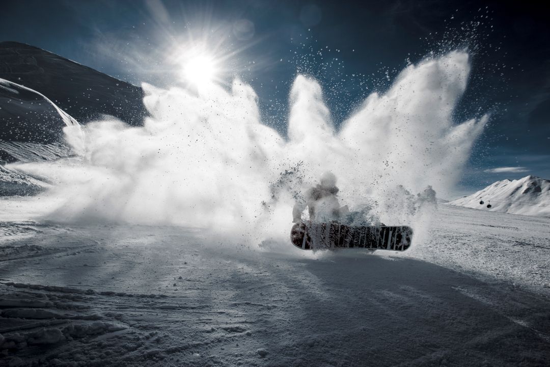 Snowboarder Creating Explosive Snow Spray on Mountain Slope - Free Images, Stock Photos and Pictures on Pikwizard.com