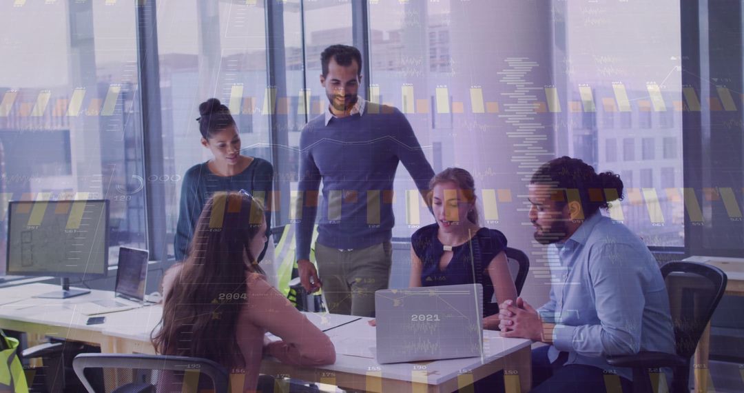 Diverse Team Analyzing Data in High-Rise Office with Technology